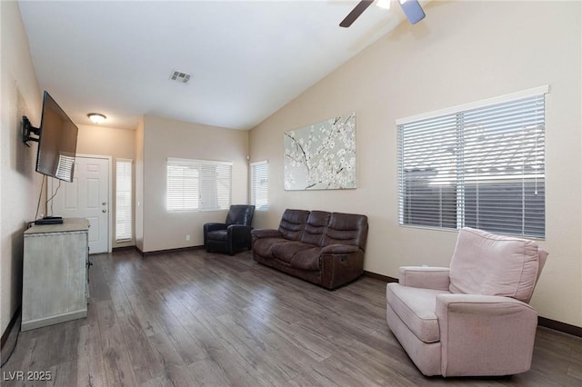 living room featuring ceiling fan, hardwood / wood-style floors, and lofted ceiling