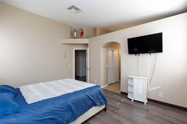 bedroom featuring hardwood / wood-style flooring