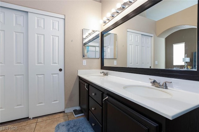 bathroom featuring tile patterned flooring and vanity