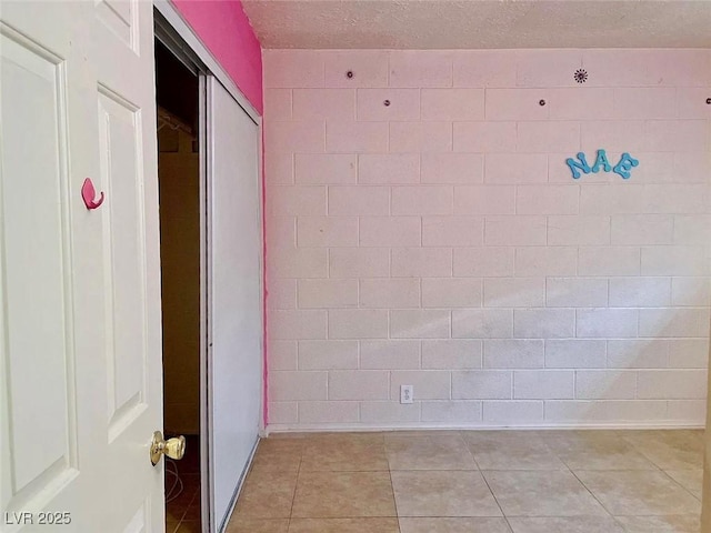 hallway featuring light tile patterned flooring