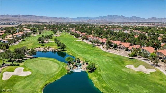 aerial view with golf course view and a water and mountain view