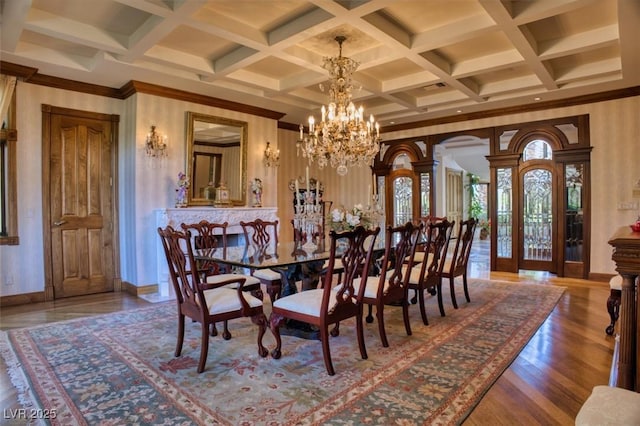 dining space featuring an inviting chandelier and hardwood / wood-style flooring