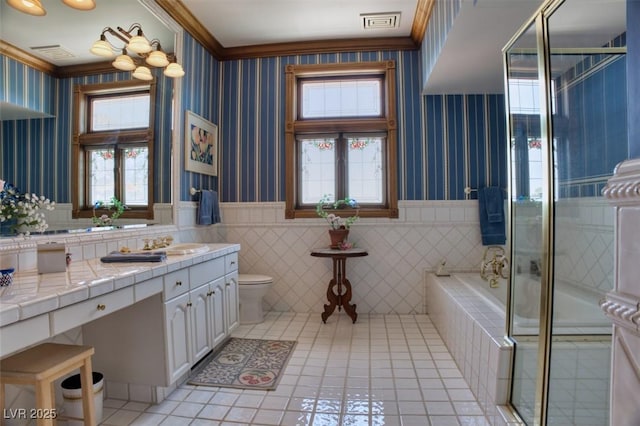 full bath featuring wainscoting, visible vents, toilet, and wallpapered walls