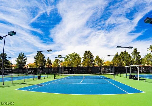 view of sport court with fence