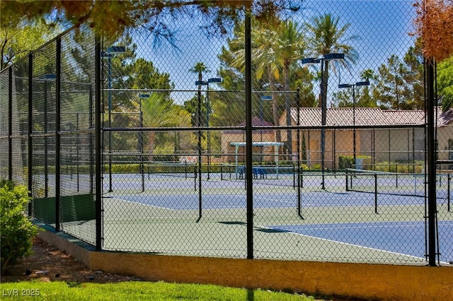 view of sport court with fence