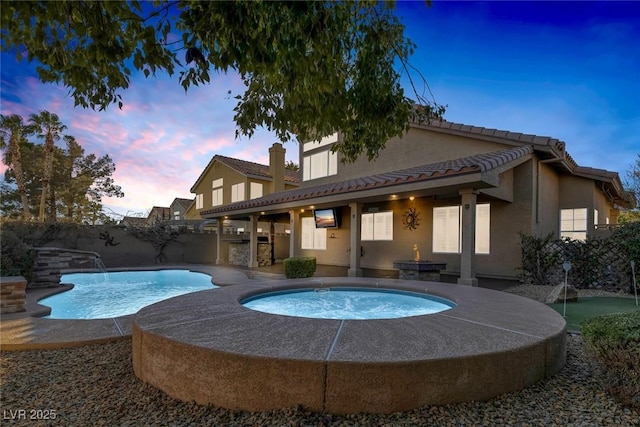 view of swimming pool with pool water feature