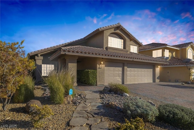 view of front of home with a garage