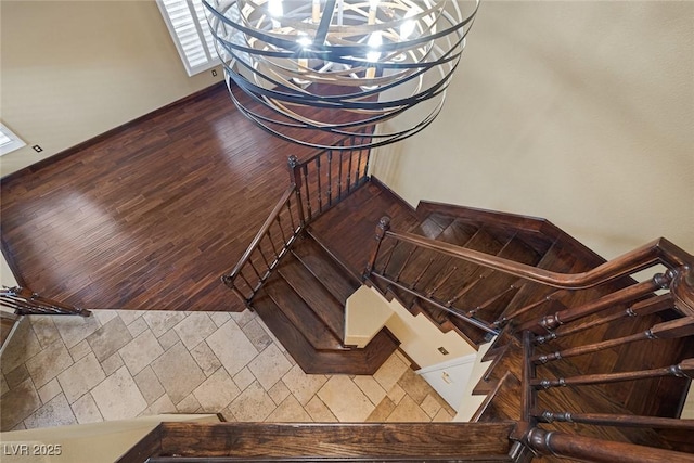 staircase with hardwood / wood-style flooring