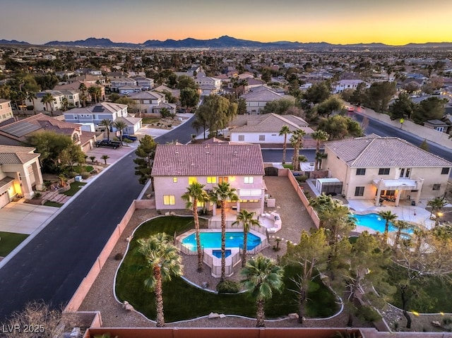 aerial view at dusk with a mountain view