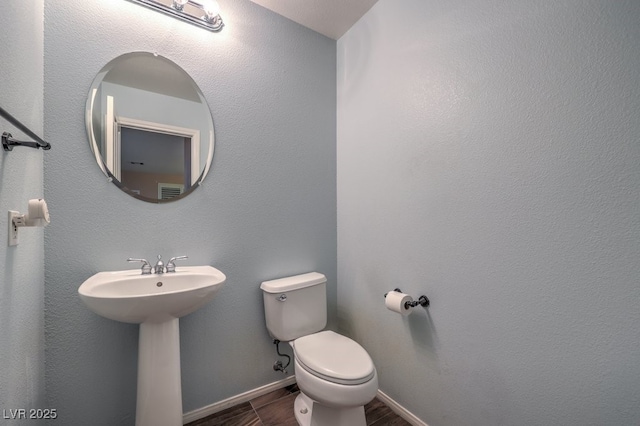 bathroom with toilet and sink