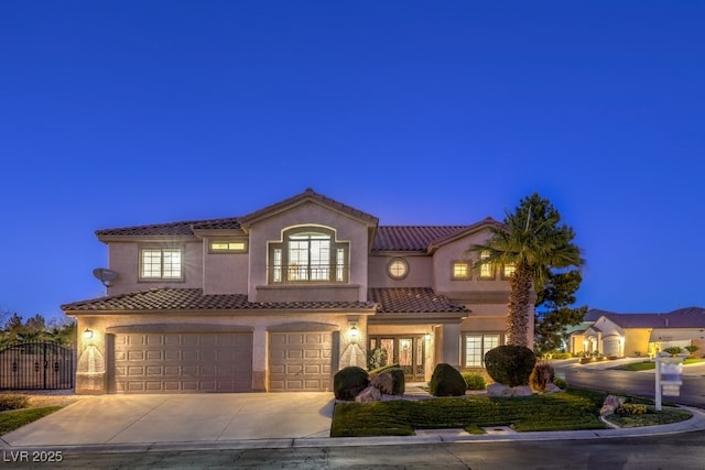 mediterranean / spanish house with a garage