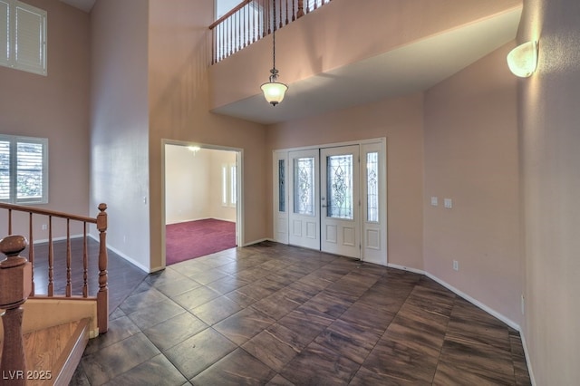 foyer entrance with a high ceiling