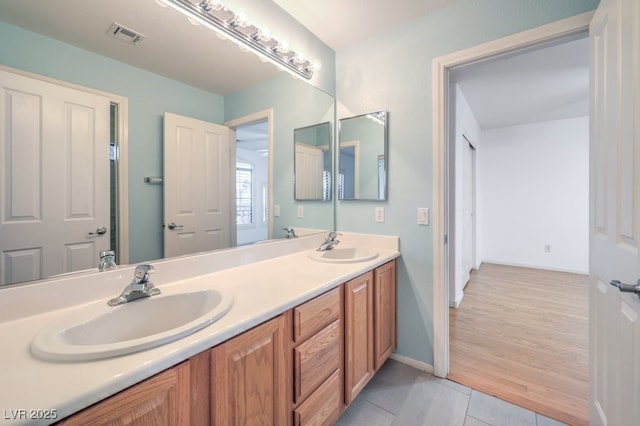 bathroom featuring tile patterned floors and vanity