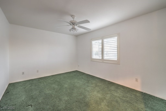 spare room featuring ceiling fan and carpet