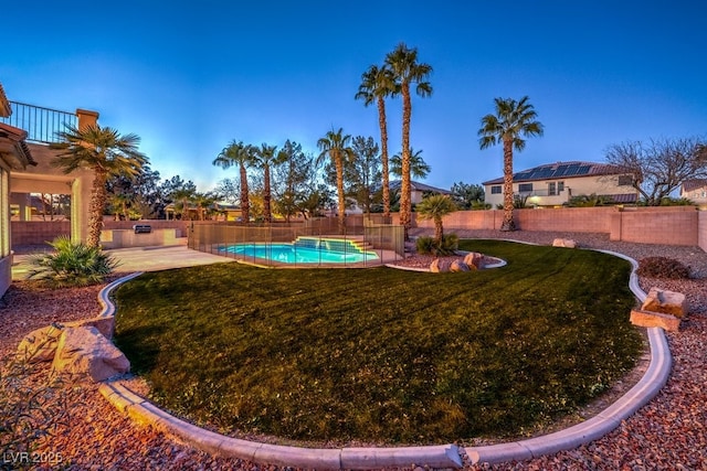 view of yard with a patio and a fenced in pool