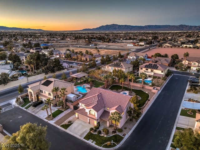 aerial view at dusk with a mountain view