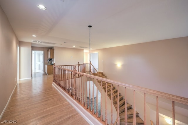 corridor featuring light hardwood / wood-style floors