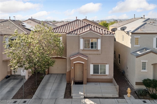 view of front facade featuring driveway, a tile roof, a garage, and stucco siding