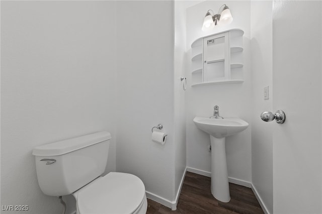 bathroom featuring toilet and hardwood / wood-style floors