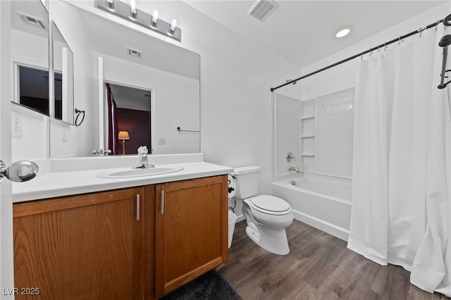 full bathroom with shower / bath combination with curtain, visible vents, and wood finished floors