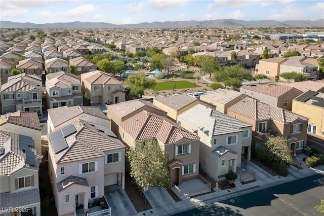 drone / aerial view featuring a residential view and a mountain view