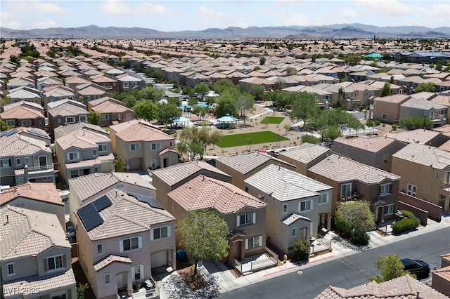 drone / aerial view with a residential view and a mountain view