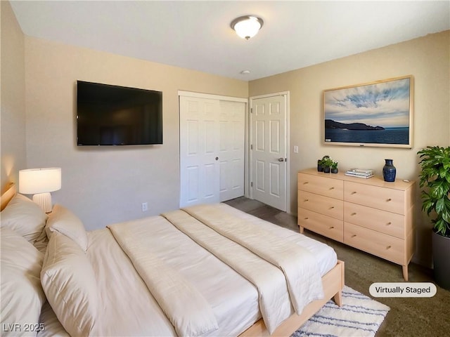 bedroom with dark colored carpet