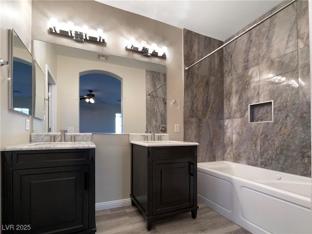 bathroom featuring ceiling fan, wood-type flooring, and vanity