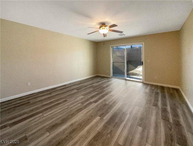 unfurnished room with ceiling fan and dark wood-type flooring