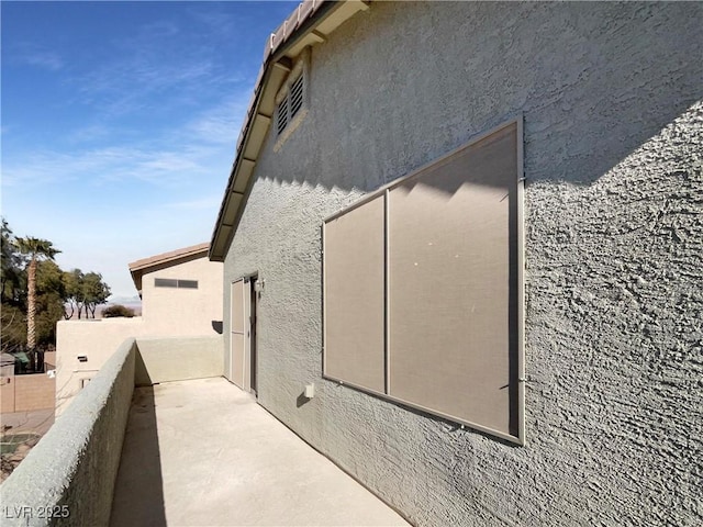 view of property exterior featuring a balcony