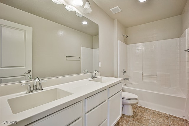 full bathroom with bathing tub / shower combination, vanity, and toilet