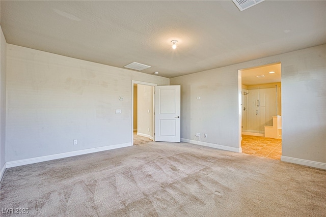 empty room with light colored carpet