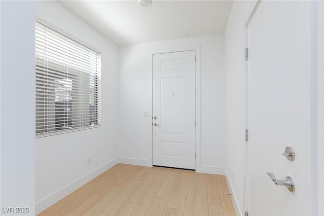 foyer with light hardwood / wood-style floors