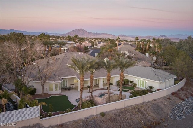 aerial view at dusk with a mountain view