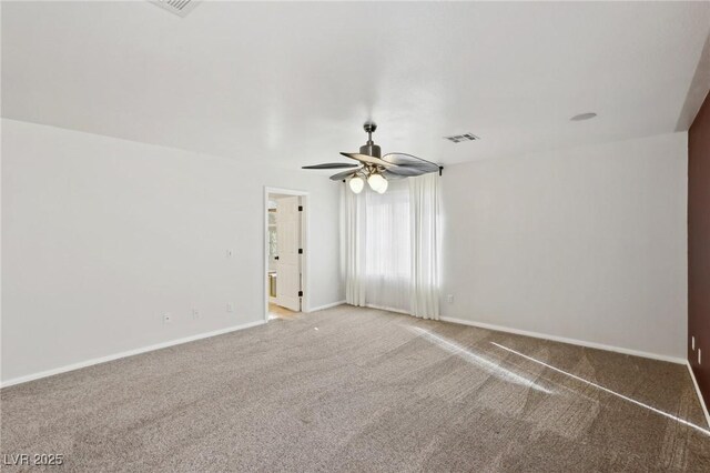 empty room with ceiling fan and carpet flooring