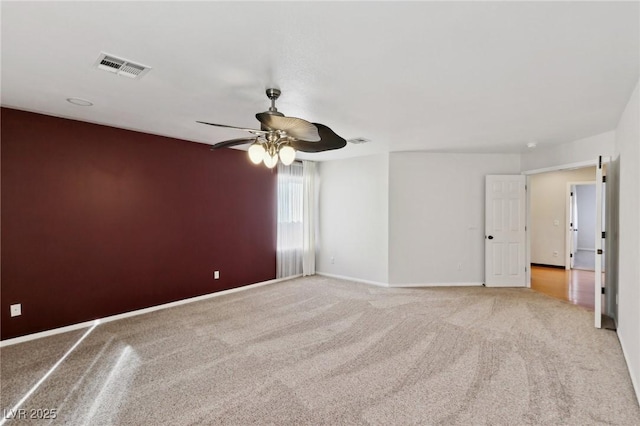 carpeted empty room with ceiling fan