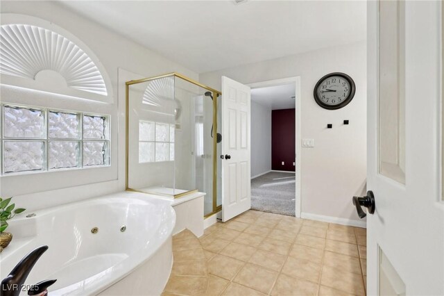 bathroom with tile patterned floors and shower with separate bathtub