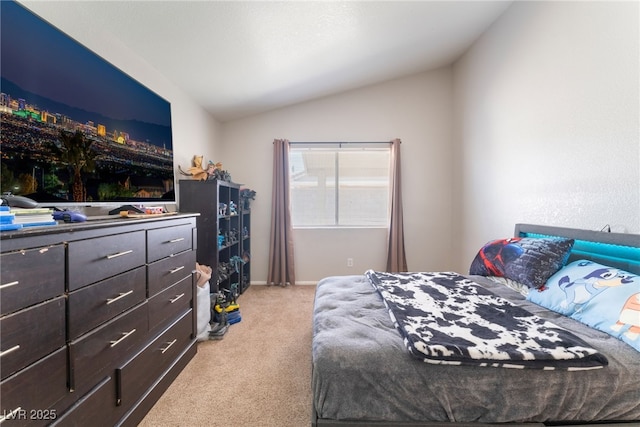 bedroom with light colored carpet and vaulted ceiling