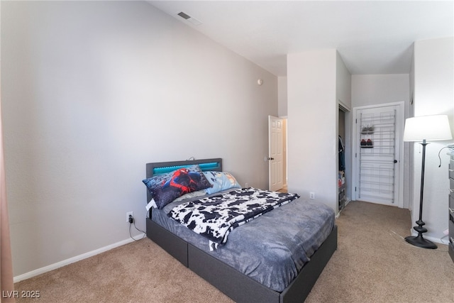 bedroom with lofted ceiling and carpet flooring