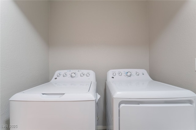 washroom with washer and dryer