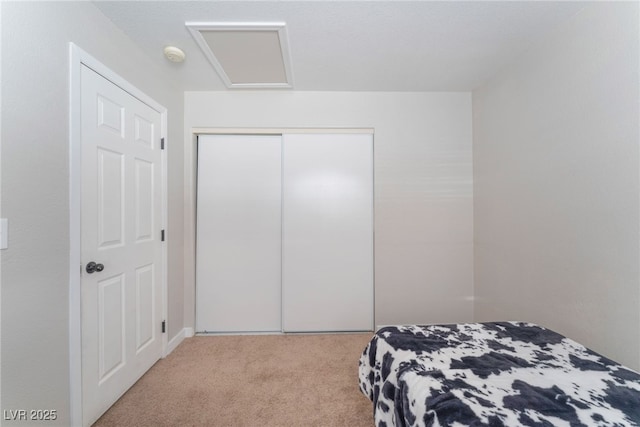 carpeted bedroom featuring a closet