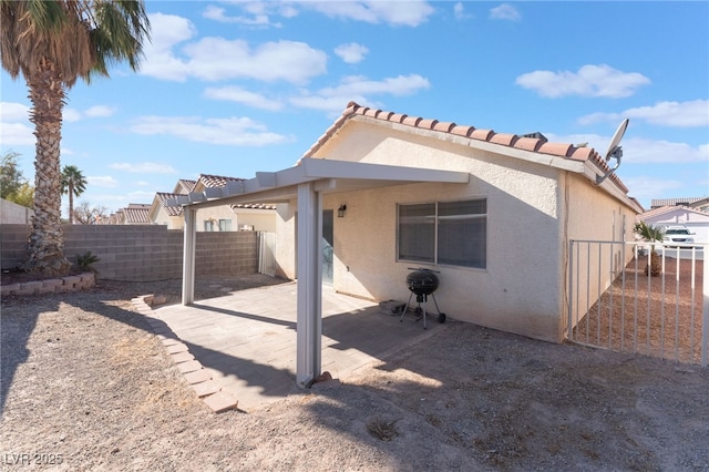 rear view of house with a patio