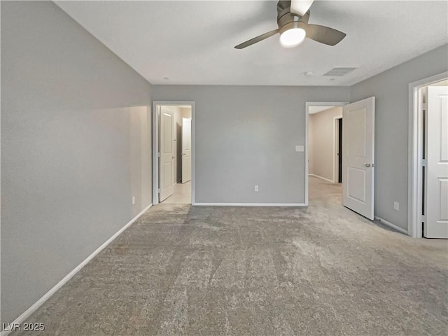 unfurnished bedroom featuring light carpet and ceiling fan