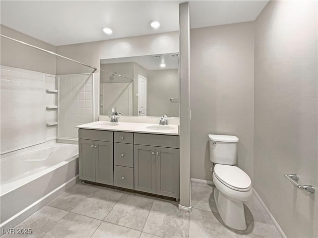 full bathroom featuring toilet, tile patterned flooring, vanity, and bathtub / shower combination