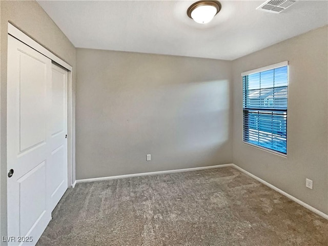 unfurnished bedroom featuring a closet and carpet floors