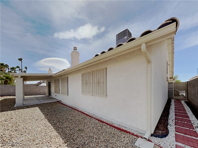 view of home's exterior featuring central AC and a patio area