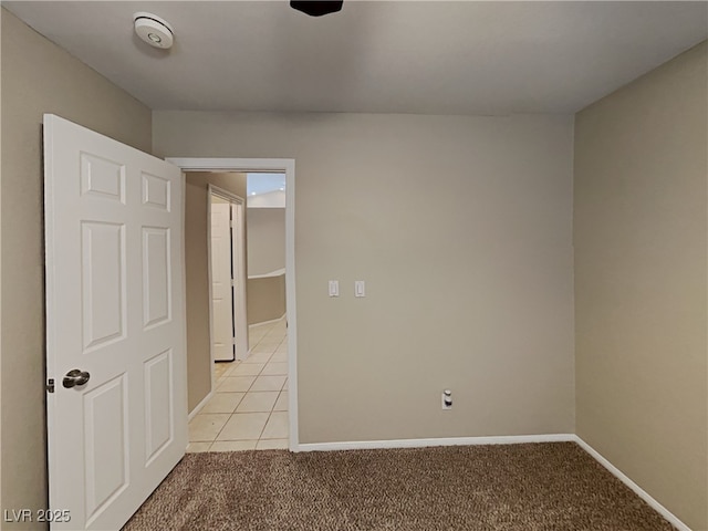 spare room featuring light tile patterned floors