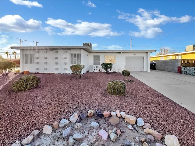 single story home featuring a garage