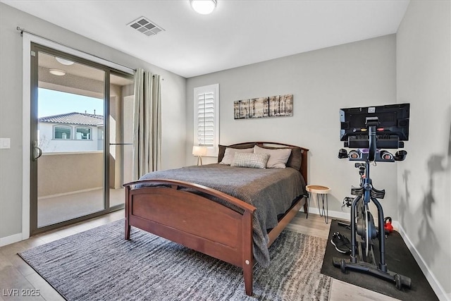 bedroom with hardwood / wood-style flooring