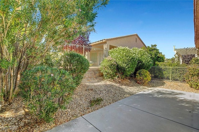 view of side of property with a patio area